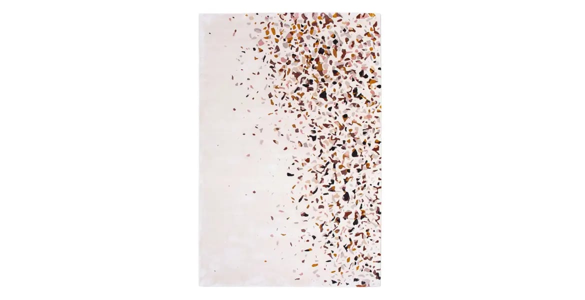 Modern terrazzo-style rug with scattered multicolor speckles on an ivory background – artistic custom carpet for luxury interiors by BOLD UAE.