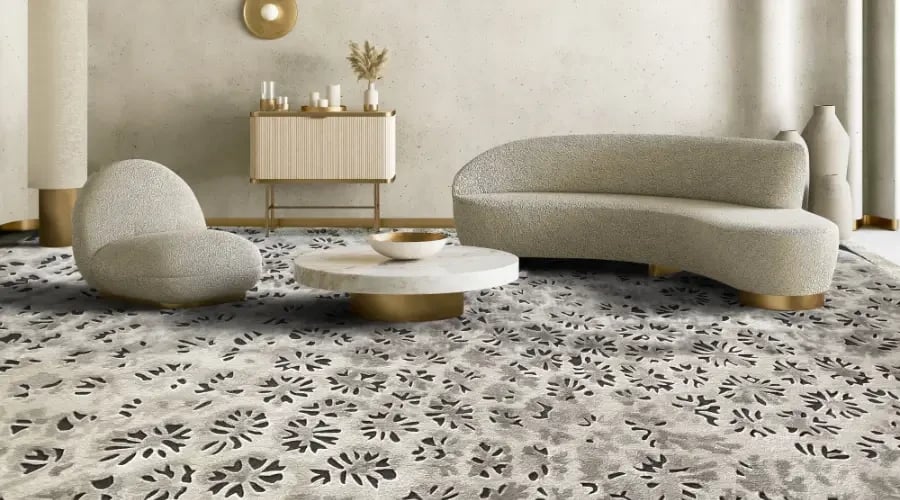Custom patterned carpet in a luxury living room with modern curved furniture and elegant decor.