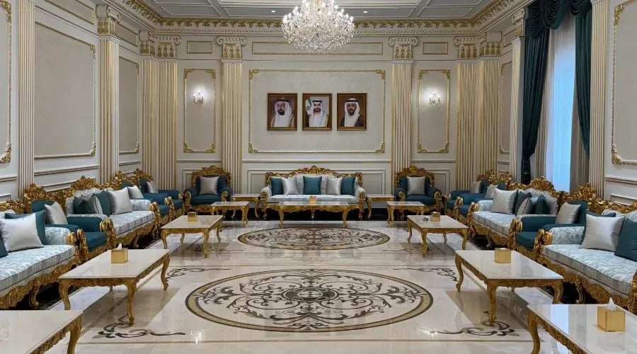Classic majlis design with gold furniture and marble flooring in a luxury UAE interior