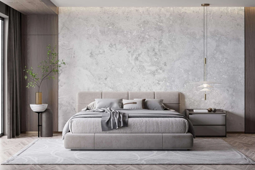 Modern bedroom featuring a soft gray marble-effect wallpaper design as the main wall, with a contemporary bed, neutral decor, and minimalist furniture.