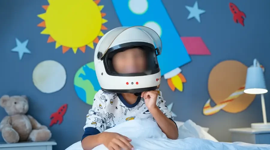 Space-Themed Kids' Bedroom with Colorful Wall Decor and Playful Design
