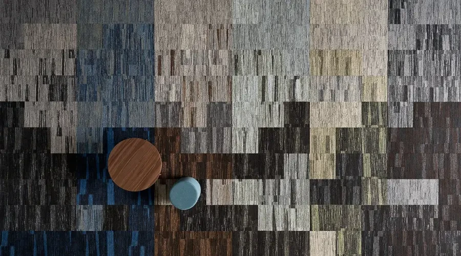 Modern custom carpet with geometric patterns in a variety of colors, highlighting unique design in a contemporary UAE home interior.