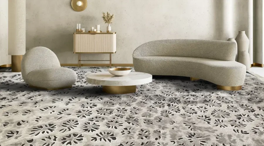Custom patterned carpet in a luxury living room with modern curved furniture and elegant decor.