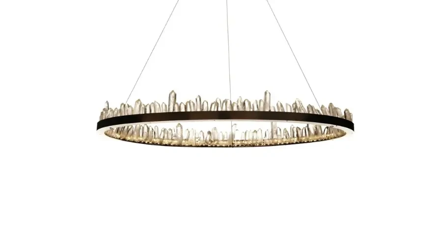 Modern circular chandelier with crystal-like edge detailing and ambient LED lighting for luxury interiors